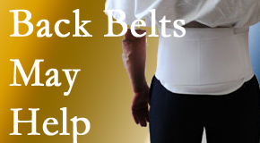 Minster back pain sufferers wearing back support belts are supported and reminded to move carefully while healing.